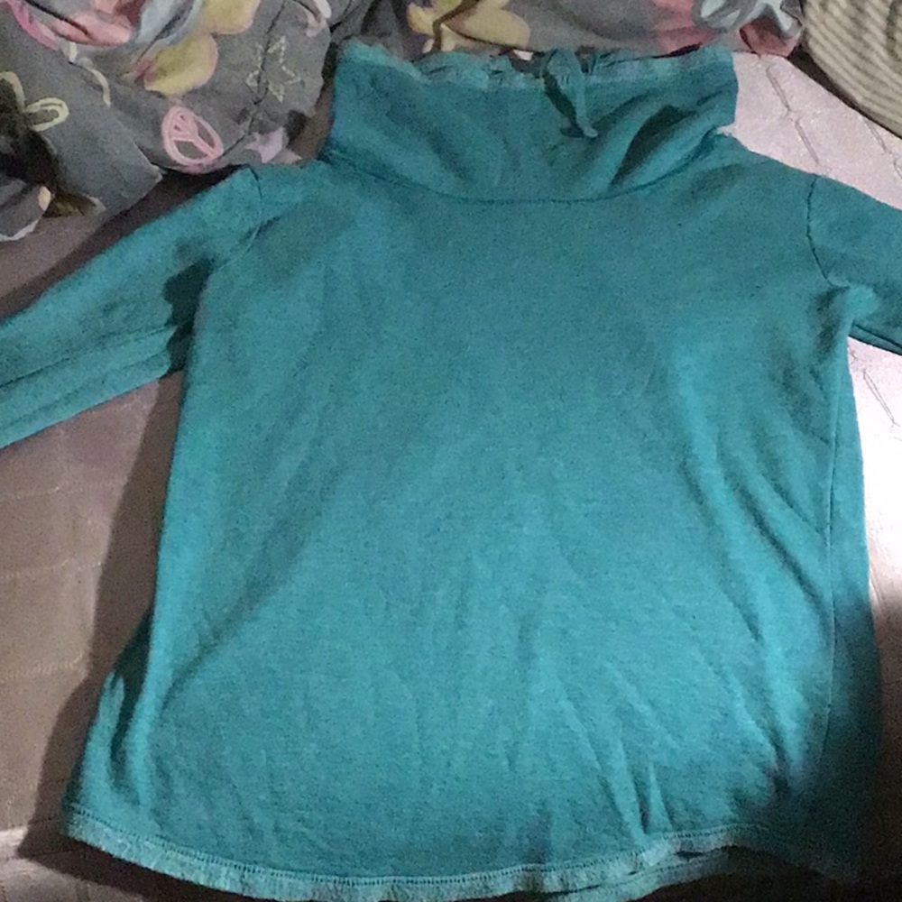 A women’s turtle neck sweater